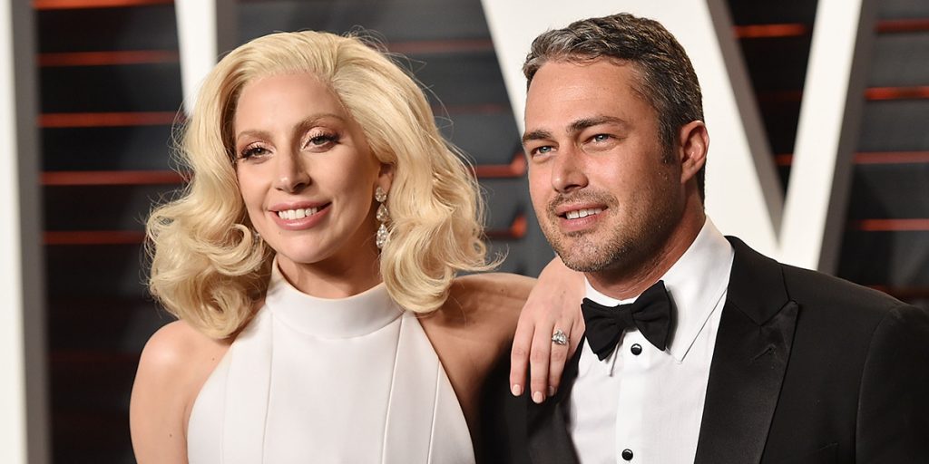 BEVERLY HILLS, CA - FEBRUARY 28: Recording artist Lady Gaga, left, and Taylor Kinney arrive at the 2016 Vanity Fair Oscar Party Hosted By Graydon Carter at Wallis Annenberg Center for the Performing Arts on February 28, 2016 in Beverly Hills, California. (Photo by John Shearer/Getty Images)